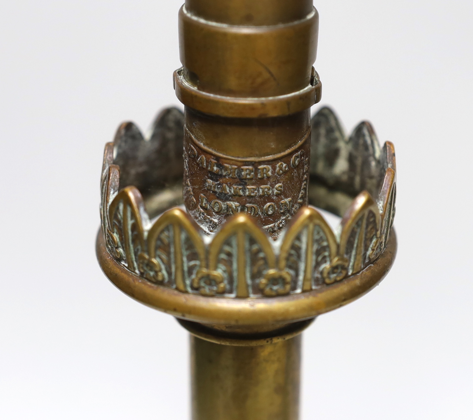 A Palmer & Co. brass lamp and an ejector candlestick, tallest 35cm